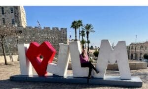 Sarah Bernstein at the JLM sign